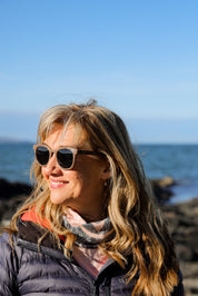 Made with sustainable speckled charcoal wheat straw or coffee residue frame and walnut wood temples, these stylish shades are lightweight, comfortable and eco-friendly with their plastic alternative materials. Fitted with UV400 polarised lenses in a smoke black colour and subtle logo is engraved on the temples. Sunglasses come with a padded pouch and microfibre cleaning cloth.