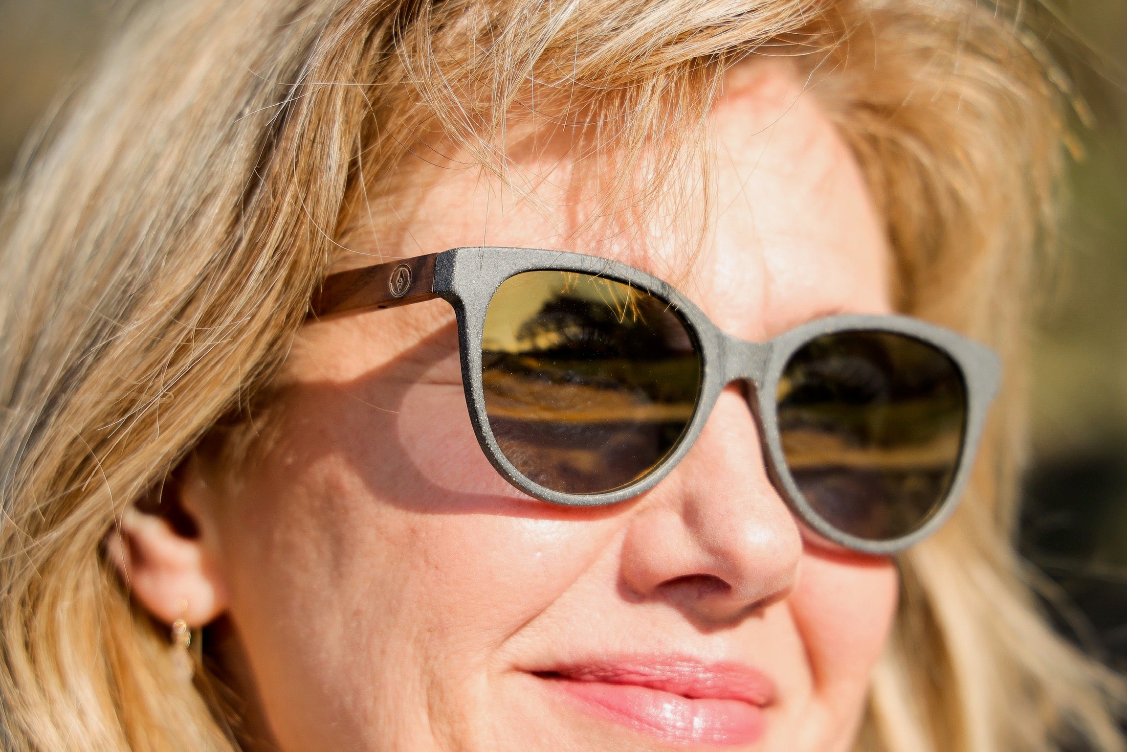 Made with a sustainable speckled wheatstraw or coffee residue frame and walnut wood temples, it's lightweight, comfortable and eco-friendly. Available in charcoal, olive green, coffee and mint frames and fitted with UV400 polarised lenses in smoke, mirrored rose pink and mirrored honey, they are a natural, biodegradable alternative to plastic sunglasses.