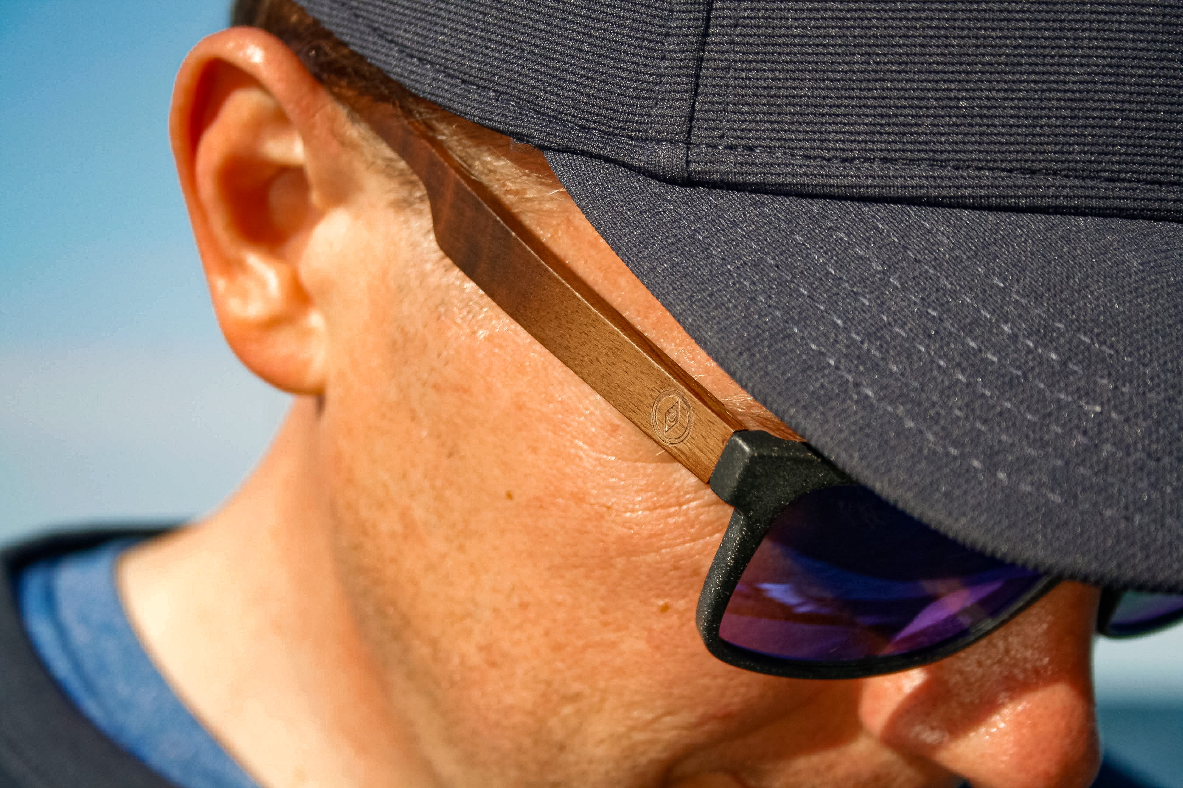 This sustainable rectangular frame is made with a speckled charcoal wheatstraw frame and walnut wood temple and is fitted with UV400 polarised lenses in two colours, smoke and mirrored sky blue. It's lightweight, comfortable and eco-friendly using plastic alternative materials.