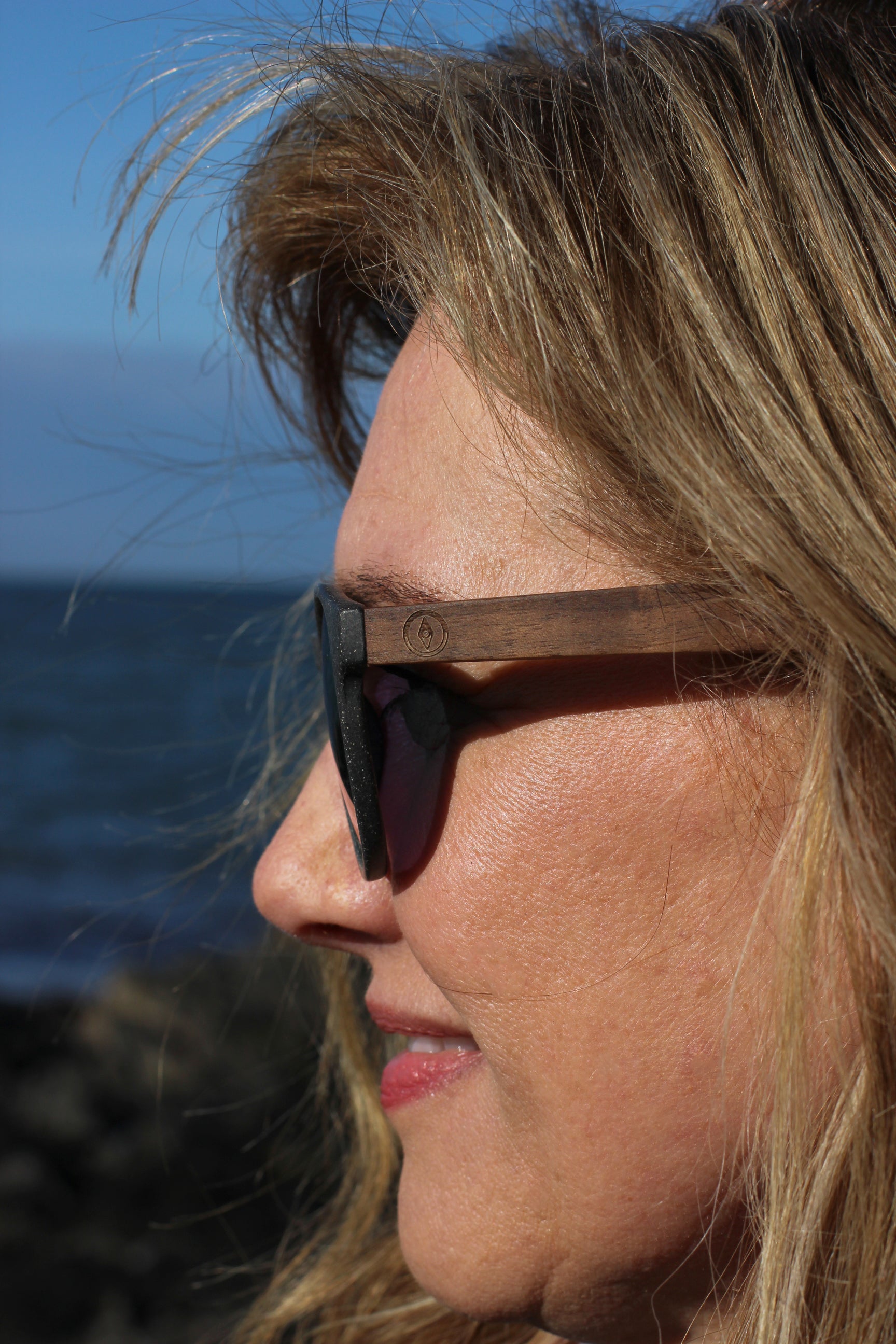 Made with a sustainable speckled wheatstraw or coffee residue frame and walnut wood temples, it's lightweight, comfortable and eco-friendly. Available in charcoal, olive green, coffee and mint frames and fitted with UV400 polarised lenses in smoke, mirrored rose pink and mirrored honey, they are a natural, biodegradable alternative to plastic sunglasses.