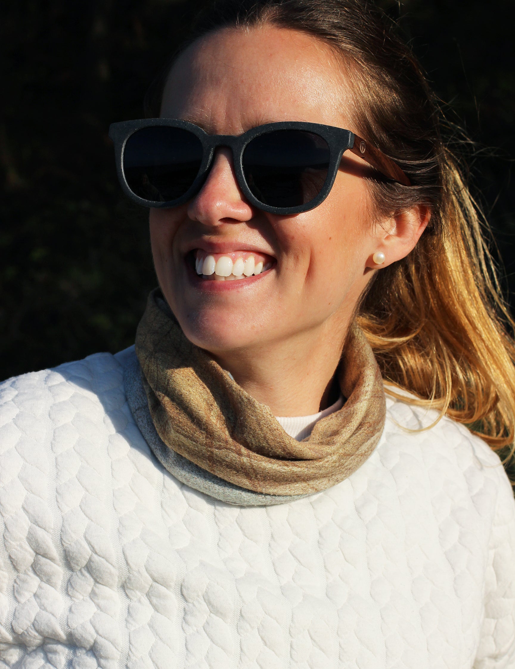 Made with sustainable speckled charcoal wheat straw or coffee residue frame and walnut wood temples, these stylish shades are lightweight, comfortable and eco-friendly with their plastic alternative materials. Fitted with UV400 polarised lenses in a smoke black colour and subtle logo is engraved on the temples. Sunglasses come with a padded pouch and microfibre cleaning cloth.