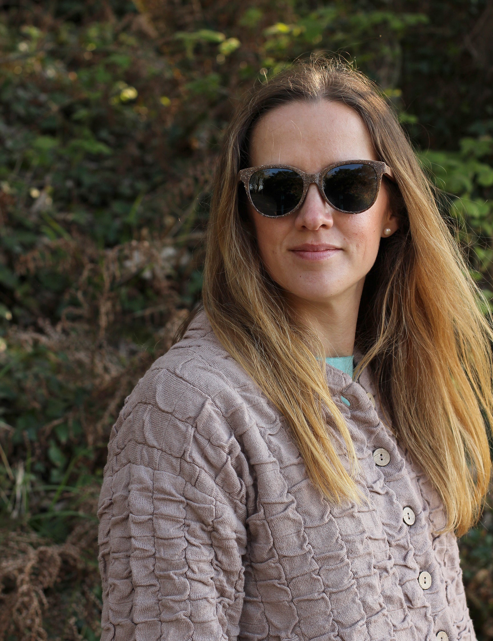 Made with a sustainable speckled wheatstraw or coffee residue frame and walnut wood temples, it's lightweight, comfortable and eco-friendly. Available in charcoal, olive green, coffee and mint frames and fitted with UV400 polarised lenses in smoke, mirrored rose pink and mirrored honey, they are a natural, biodegradable alternative to plastic sunglasses.