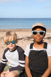 Made with a sustainable speckled wheatstraw frame with walnut wood temples, it's lightweight and comfortable. Fitted with UV400 polarised lenses. Our large child/teen/small adult frame and provides a neater fit without compromising on eye protection.