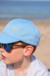 Made with a sustainable speckled wheatstraw frame with walnut wood temples, it's lightweight and comfortable. Fitted with UV400 polarised lenses. Our large child/teen/small adult frame and provides a neater fit without compromising on eye protection.