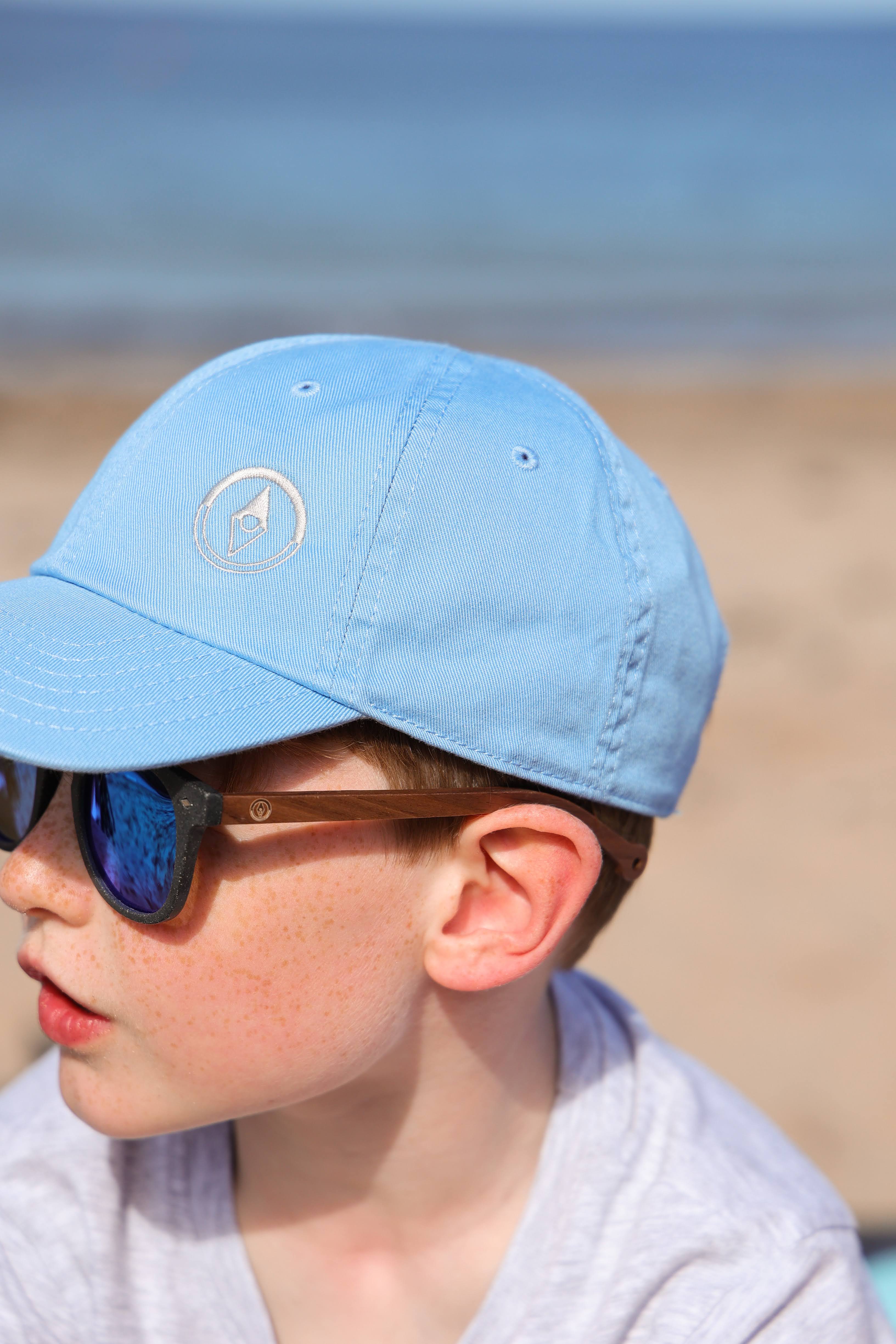 Made with a sustainable speckled wheatstraw frame with walnut wood temples, it's lightweight and comfortable. Fitted with UV400 polarised lenses. Our large child/teen/small adult frame and provides a neater fit without compromising on eye protection.