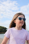Made with a sustainable speckled wheatstraw frame with walnut wood temples, it's lightweight and comfortable. Fitted with UV400 polarised lenses. Our large child/teen/small adult frame and provides a neater fit without compromising on eye protection.