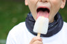 Close up image of a young boy wearing the multiway Infinity Band (snood) around his neck outdoors eating an ice lolly showing its grey and black design inspired by The Giants Causeway in Northern Ireland. 