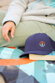 Sustainable waterproof picnic blanket made from recycled polyester, oversized yet packable as it folds flat into a laptop size to slide into a backpack. Zip corner pocket and stake loops and sand pockets to keep it in place. 