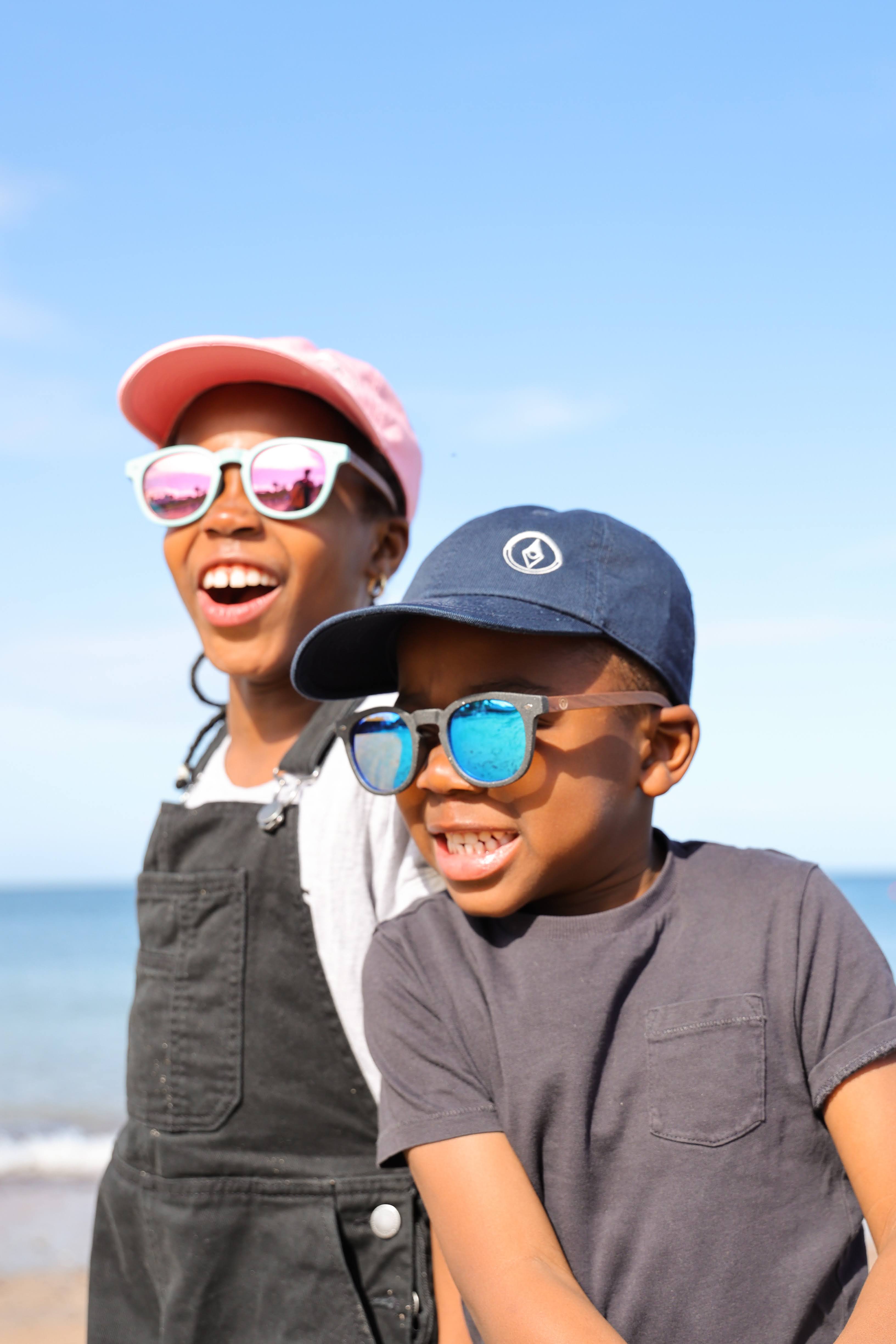 Made with a sustainable speckled wheatstraw frame with walnut wood temples, it's lightweight and comfortable. Fitted with UV400 polarised lenses. Our large child/teen/small adult frame and provides a neater fit without compromising on eye protection.