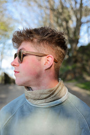 A classic soft rectangular frame. Made with a sustainable speckled charcoal wheatstraw or coffee residue frame and walnut wood temples, it's lightweight and comfortable offering the highest protection with UV400 polarised lenses in a smoke black colour or mirror sky blue. Eco-friendly using plastic alternative frames t…