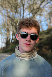 A classic soft rectangular frame. Made with a sustainable speckled charcoal wheatstraw or coffee residue frame and walnut wood temples, it's lightweight and comfortable offering the highest protection with UV400 polarised lenses in a smoke black colour or mirror sky blue. Eco-friendly using plastic alternative frames t…