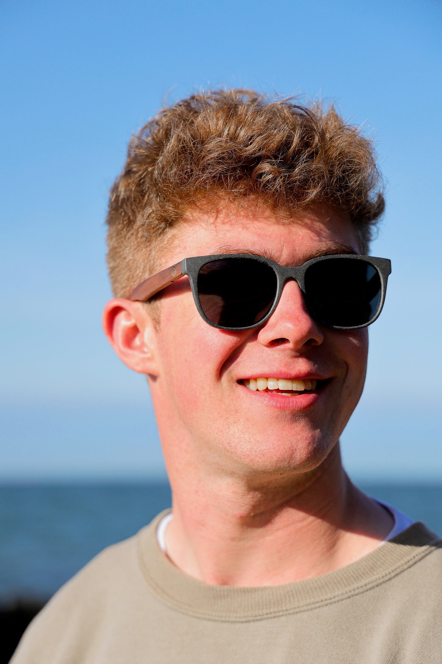 A classic soft rectangular frame. Made with a sustainable speckled charcoal wheatstraw or coffee residue frame and walnut wood temples, it's lightweight and comfortable offering the highest protection with UV400 polarised lenses in a smoke black colour or mirror sky blue. Eco-friendly using plastic alternative frames t…