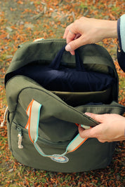 Sustainable waterproof picnic blanket made from recycled polyester, oversized yet packable as it folds flat into a laptop size to slide into a backpack. Zip corner pocket and stake loops and sand pockets to keep it in place. 