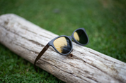 Made with a sustainable speckled wheatstraw or coffee residue frame and walnut wood temples, it's lightweight, comfortable and eco-friendly. Available in charcoal, olive green, coffee and mint frames and fitted with UV400 polarised lenses in smoke, mirrored rose pink and mirrored honey, they are a natural, biodegradable alternative to plastic sunglasses.