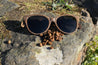 Made with a sustainable speckled wheatstraw or coffee residue frame and walnut wood temples, it's lightweight, comfortable and eco-friendly. Available in charcoal, olive green, coffee and mint frames and fitted with UV400 polarised lenses in smoke, mirrored rose pink and mirrored honey, they are a natural, biodegradable alternative to plastic sunglasses.