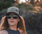This sustainable rectangular frame is made with a speckled charcoal wheatstraw frame and walnut wood temple and is fitted with UV400 polarised lenses in two colours, smoke and mirrored sky blue. It's lightweight, comfortable and eco-friendly using plastic alternative materials. 